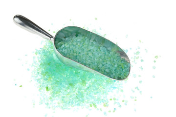 green sea salt in metal scoop isolated on white background.Sea bath salt with plant...