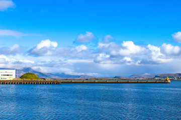 harbor in Iceland with blue water and sky