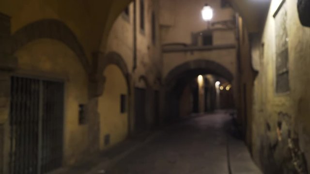 Old Italian archway above narrow road