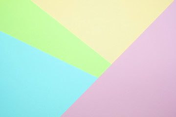 Obraz premium Fashionable pastel colored paper flat lay top view, geometric background texture, pink, purple, yellow, beige, green and blue.