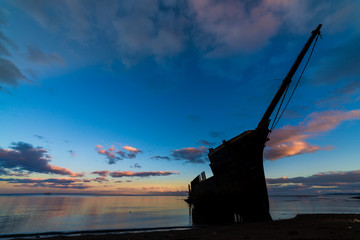 An old shipwreck on coastline