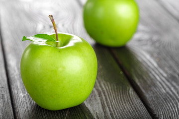 green apple on wooden background