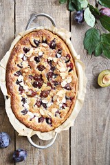 Plum cake. Spicy cake with plums, almond filling and cinnamon. Overhead view