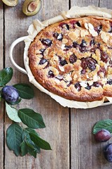 Plum cake. Spicy cake with plums, almond filling and cinnamon. Overhead view