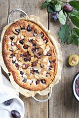 Plum cake. Spicy cake with plums, almond filling and cinnamon. Overhead view