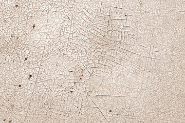 Crack and damage on painted texture in brown tone.