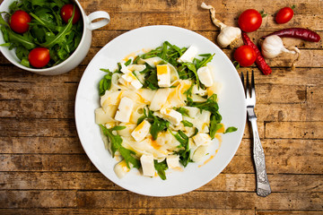 Homemade pasta with arugula on a plate