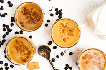 Cups of coffee and roasted beans