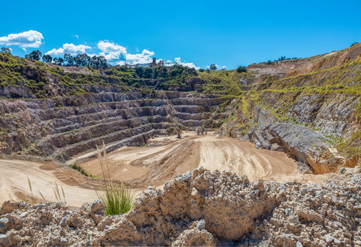 Limestone quarry pit on bright sunny day