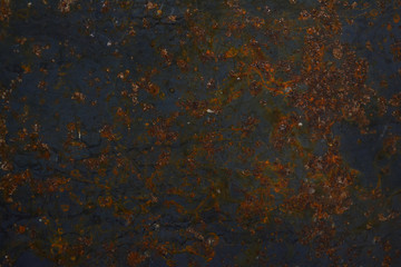 the iron surface covered with a coating of rust