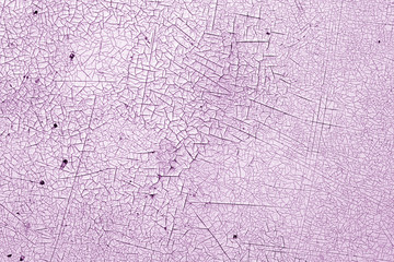 Crack and damage on painted texture in purple tone.