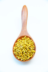 Coriander seed in wooden spoon on White background
