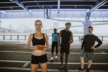 Group of urban runners running on the street in New york city, conceptual series about sport and...