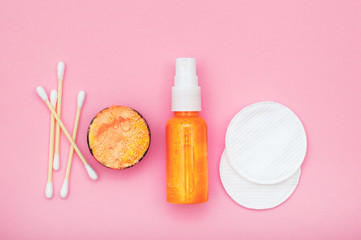 Cosmetic products on pink background