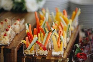 vegetable sticks in cream sauce in small glasses.