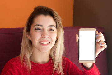 Girl showing a blank screen of the smartphone to the camera