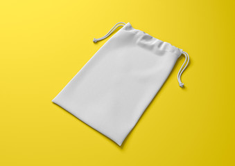 Drawstring bag on background. Fabric cotton small bag. Isolated pouch.