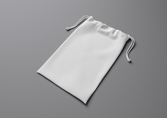 Drawstring bag on background. Fabric cotton small bag. Isolated pouch.