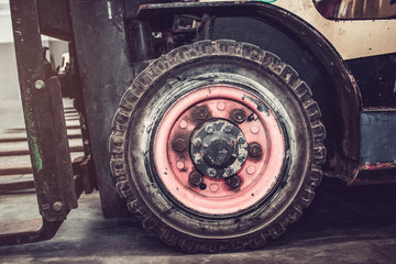 The front wheels of the forklift.