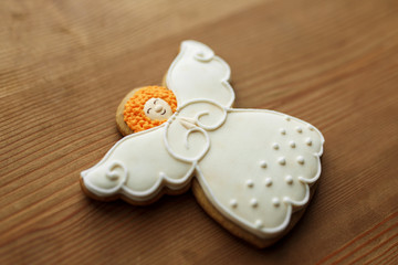 Christmas angel gingerbread cookie. Holidays food and decoration concept.