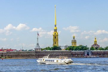 Passenger ship on hydrofoils floating on the Neva river opposite the Peter and Paul fortress