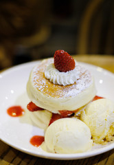 closeup fluffy pancake with fresh strawberry