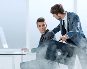 two businessmen during the beginning of the fire