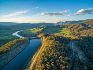 Scenic hills and river in beautiful Australian countryside at sunset