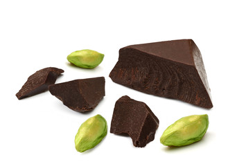  Broken chocolate pieces morsels and pistachios isolated on white background