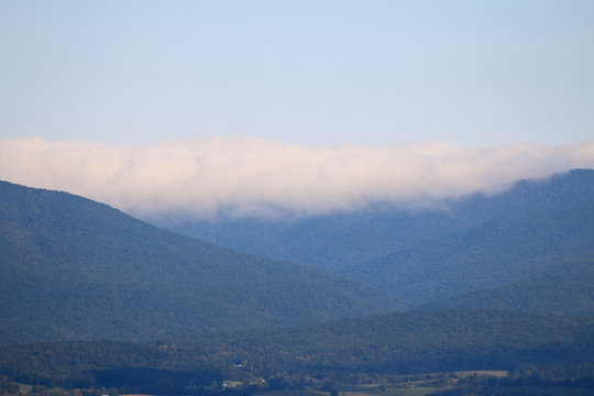 rolling clouds over mountains