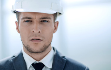 builder in a helmet smiles