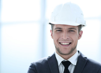 builder in a helmet smiles