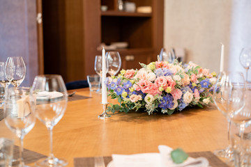 beautiful flower arrangement. Wedding Banquet or gala dinner. The chairs and table for guests, served with cutlery and crockery.