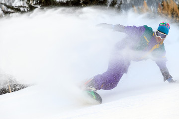 Beautiful young man with vintage retro outfit snowboarding on the ski slopes on a winter day in the Alps in the Brandnertal, Vorarlberg Austria © dennisvdwater