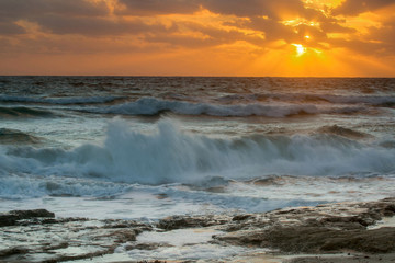 sunrise over the stormy sea