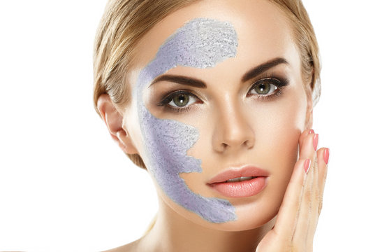 Woman with cosmetic scrab mask on face.