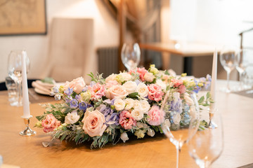 beautiful flower arrangement. Wedding Banquet or gala dinner. The chairs and table for guests, served with cutlery and crockery.