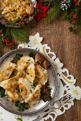 Traditional dumplings with cabbage and mushrooms. Christmas decoration.