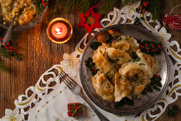 Traditional dumplings with cabbage and mushrooms. Christmas decoration.
