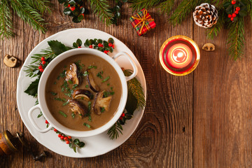 Traditional mushroom soup, made from porcini mushrooms. Christmas decoration.