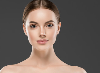 Healthy skin face brunette woman closeup face beautiful eyes cosmetic concept young model over gray...