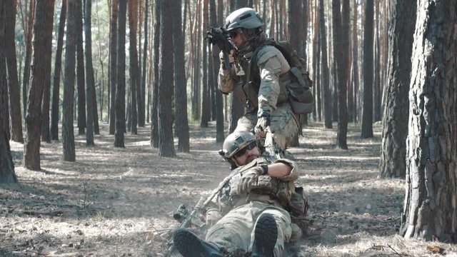 Slow motion of soldier is wounded on battlefield in the forest