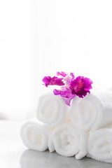 Towels on table with copy space blurred bathroom background. For product display montage.