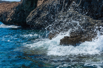 waves crashing on rocks