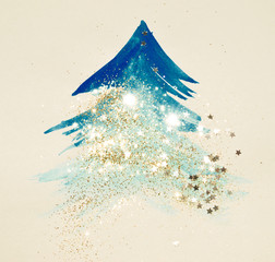 Glitter and glittering stars on abstract blue watercolor Christmas tree in vintage nostalgic colors.
