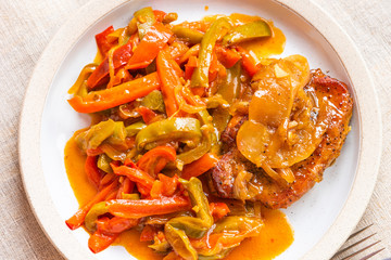 Italian food - pork chop with apples and peperonata