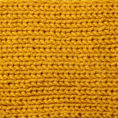 Yellow knitted wool texture background pattern with high resolution. Top view. Copy space.