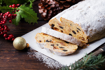 Christmas stollen. Traditional German festive dessert. Wooden background. Copy space.