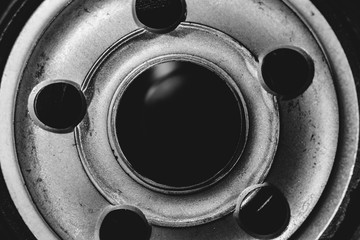 Monochrome background image of oil filter close up. Artwork from auto part in macro photography in grayscale.