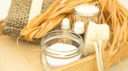 Eco accessories for body care and spa - bast, loofah, wooden cotton swabs in a glass jar, essential...